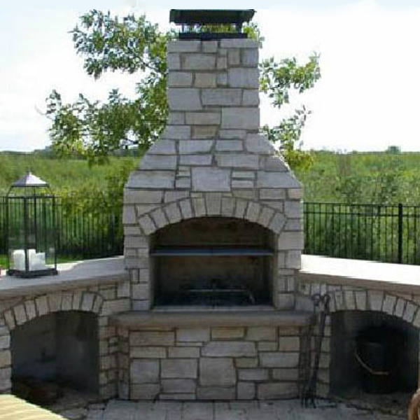 Four reasons an outdoor fireplace chimney needs a chimney cap and why an outdoor chimney stone topper is not sufficient.