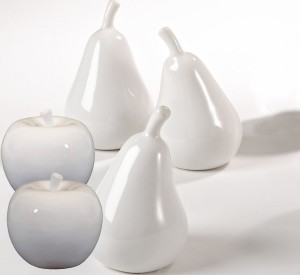 White ceramic fruit including apples and pears are a more formal look than fresh fruit.