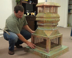 Andy Preske with one of his handcrafted copper chimney pots