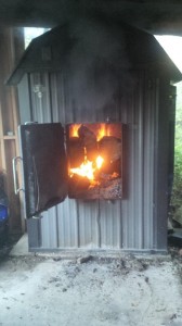 First Fire of the Season in a Wood-Burning Furnace.