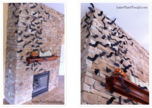 Cut bat shapes from black cardstock, fold wings, and attach to fireplace with sticky tack.