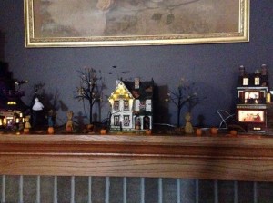 Halloween houses on the fireplace mantel.