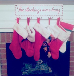 This plaque with its own hooks makes it simple to display the family stockings.