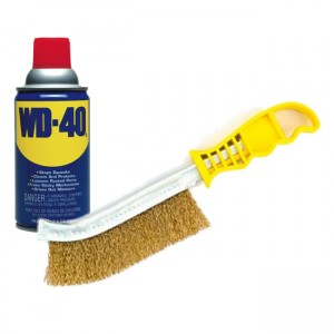 Use a wire brush and WD-40 to open a stuck fireplace damper.