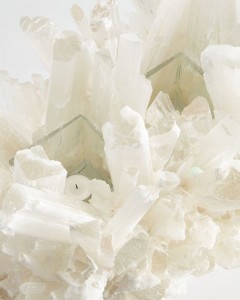 Votive candles within the selenite fireplace sculpture