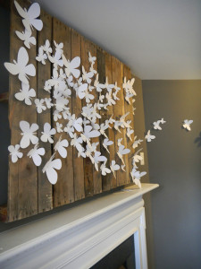 3D butterflies above fireplace are an inexpensive way to decorate