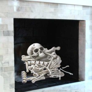 scattered bones replace logs in fireplace for Halloween