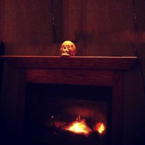 single skull dramatizes Halloween mantel